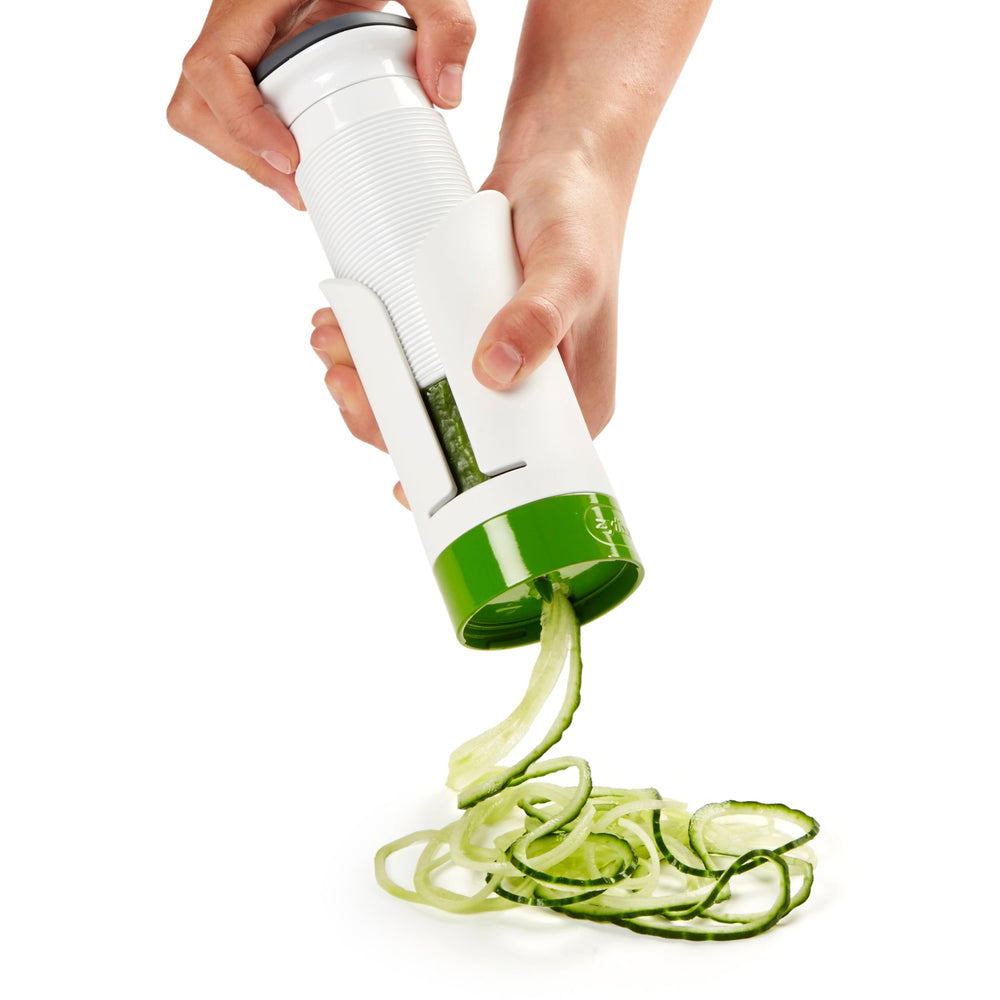 The Zyliss Spiralizer is a white and green plastic, cylindrical tool with a gray top and open front displaying a ridged interior, designed for easy gripping and opening of jars or bottles. 
