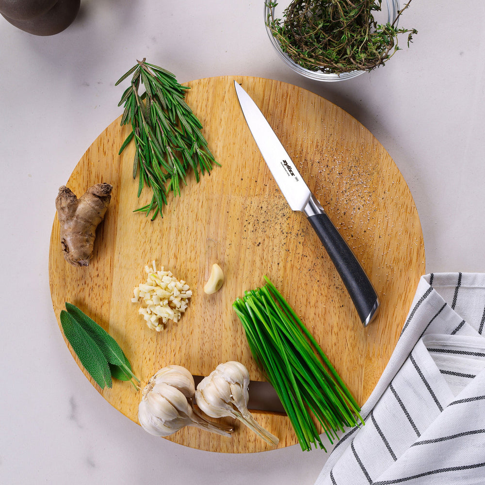 A Zyliss Comfort Pro Paring Knife 11cm/4½", made from German stainless steel with a pointed blade and grey ergonomic handle, shown on a plain light background.