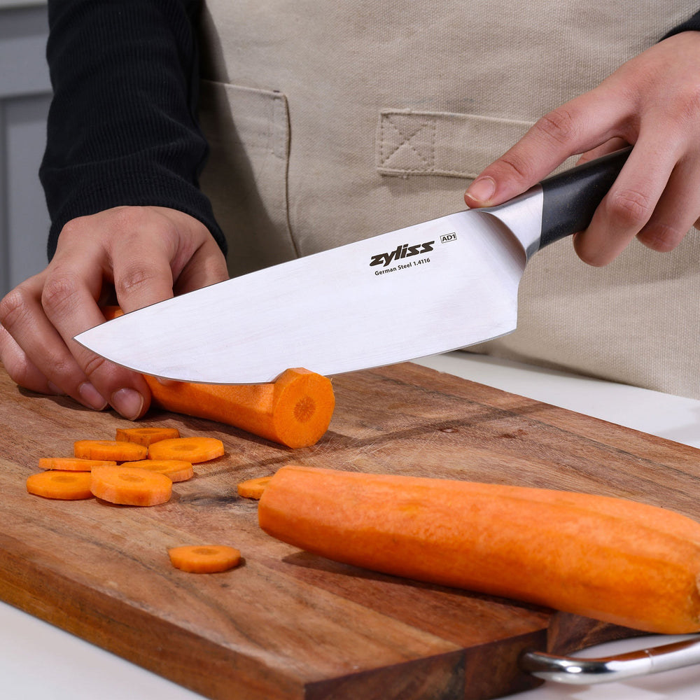 The Zyliss Comfort Pro Chef Knife 19cm (7½") features a German stainless steel silver blade and an ergonomic gray and silver handle, shown on a light background.