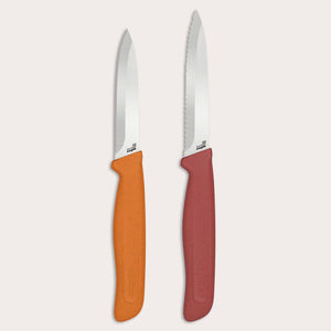 The Zyliss Classic 2 Piece Paring Knife Set includes two kitchen knives: one with an orange ergonomic handle and straight-edged stainless steel blade, and another with a red handle and serrated stainless steel blade.