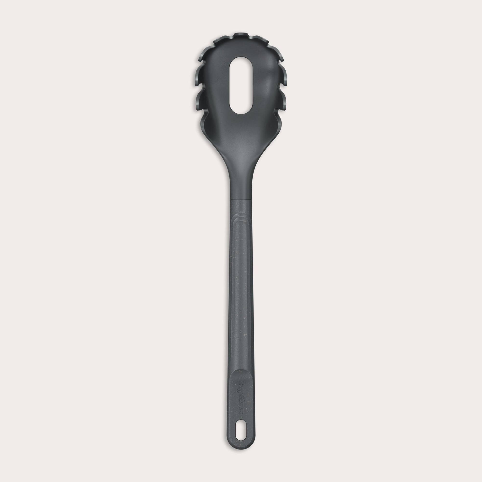 The Zyliss Spaghetti Server is a black, heat-resistant utensil with a long handle and slotted, rounded head featuring prongs for ideal portion control, shown isolated on a light background. 