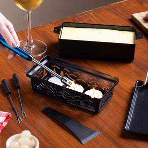 Zyliss Tandem Candlelight Fondue & Raclette Set — in use