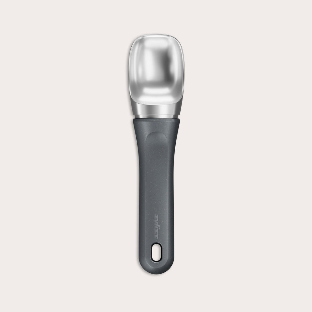 #belugagrey The Zyliss Ice Cream Scoop, featuring a wide deep bowl and eco-friendly handle, is displayed against a plain light background. 